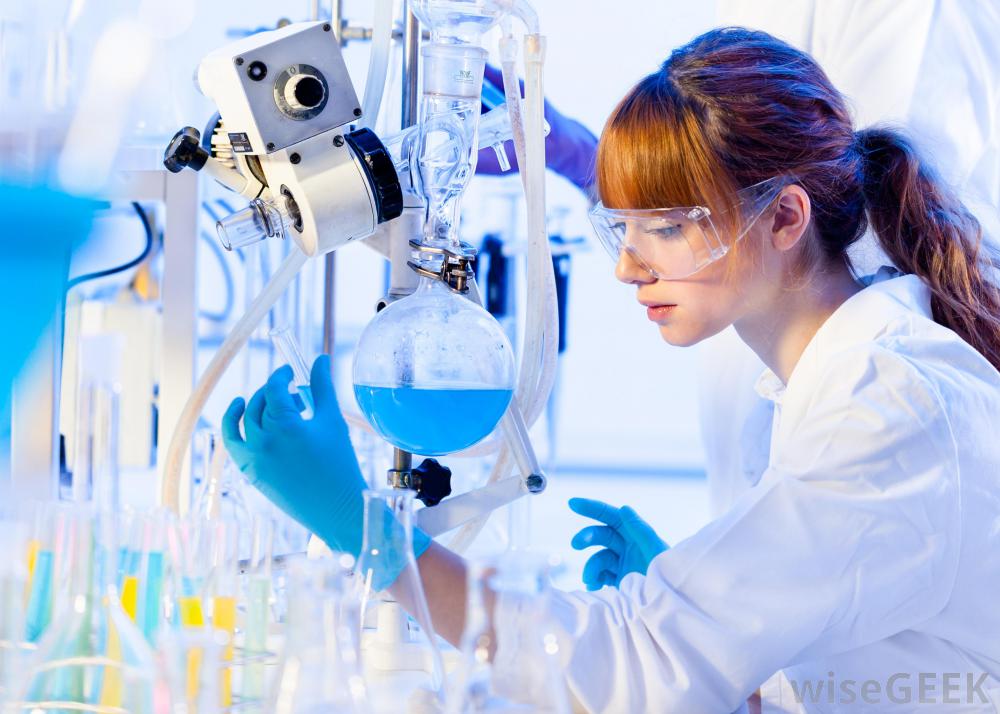 Female scientist with blue gloves and flask